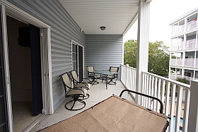 Sky Blue Vacation Condo, Myrtle Beach - Upper Balcony with hammock, table four chairs